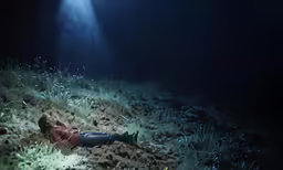 a man is lying on the ground near the lights