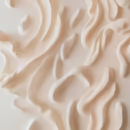 a cream swirl is shown with the white background
