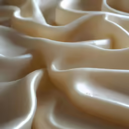 some very pretty white satin fabric in close up