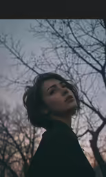 an image of a woman looking up at something