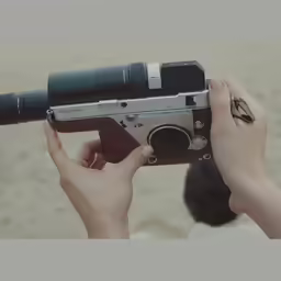 a person holding a camera and looking through it