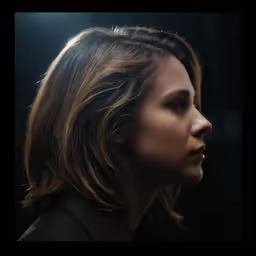 a young woman with brown hair in the spotlight