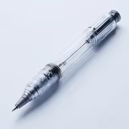 a pen sitting on top of a white surface