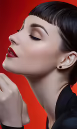 a close up shot of a woman with her hands in her hair
