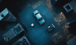 aerial view of car parked next to office buildings