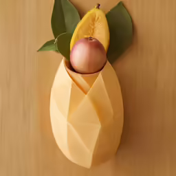 two apples in a vase with green leaves