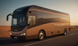 a bus is shown on a street with the sunset in the background
