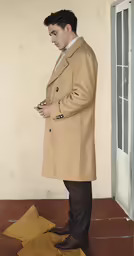 a man in a beige coat is holding a piece of cloth