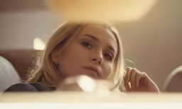 there is a young woman that is looking down at something