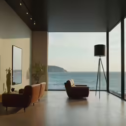 an empty room with modern furnishings and a view of the ocean