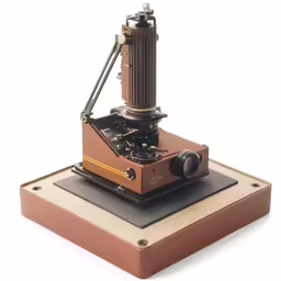 an old - fashioned portable projector sitting on top of a base