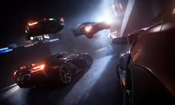 cars parked in a lot with headlights on at night