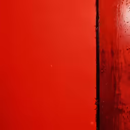the red side of the wall is partially peeled off