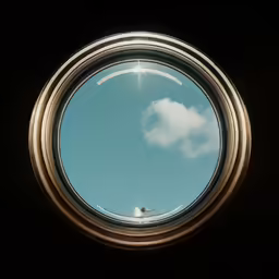 a small window looking at the sky with clouds