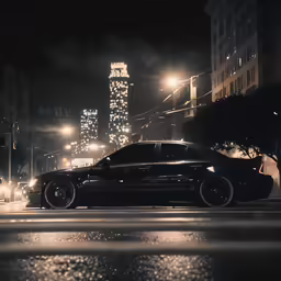 a black car parked at night in the city