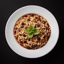 some food in a white bowl on top of a table