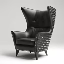 an art deco chair with studding on the arm and arms