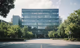 a very tall office building near the woods