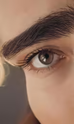 a woman is shown with her eye opened