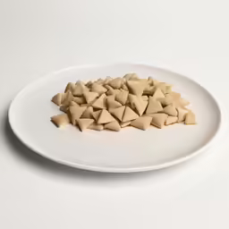 a plate with small triangular shaped cut out food