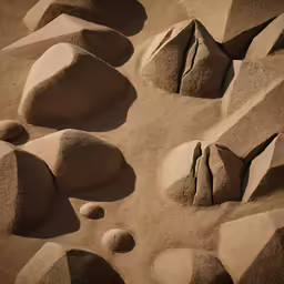 various rocks in the sand on a sunny day