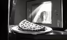 a cake on a plate in front of a mirror