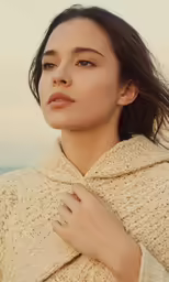 a woman in white coat and tan coat