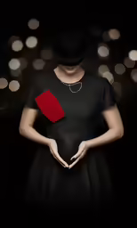a woman is holding a piece of paper and wearing a black dress