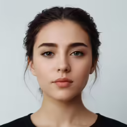the face of a young woman with makeup in profile