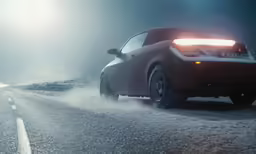 a car on a snowy highway with fog and snow