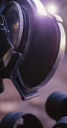 a spotlight light that is on top of some metal poles