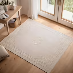 a room with wooden flooring, large rug and furniture