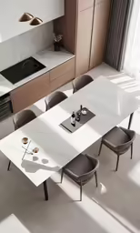 a long table with four chairs near an oven