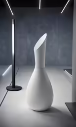 an abstract vase in a dimly lit room