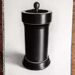 this is an old photograph of a black trash can