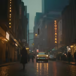 people walk across a street during the night