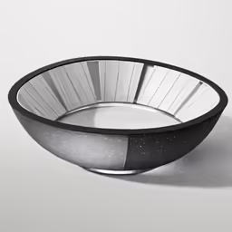 a large bowl on a white table with black and white designs