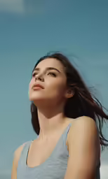 a beautiful young lady with a sky background