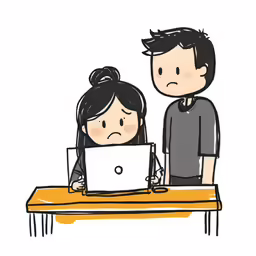 two people sit at a table with a laptop