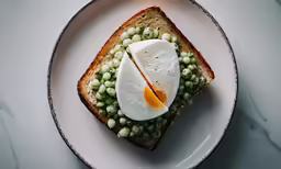 an open faced sandwich has a hard boiled egg in it