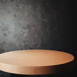 the top of a wood table with a circular shape