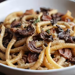a bowl with an assortment of different types of pasta