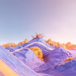 a bird flying by on some sand that has colored water