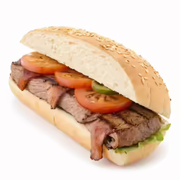 a large sandwich with tomatoes and meat inside