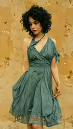 a beautiful young woman in a blue dress