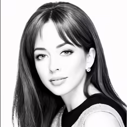 an attractive young woman in a black and white photo