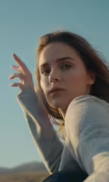 a young woman looking forward on the beach