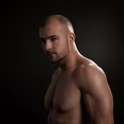 an image of a naked man posing for the camera
