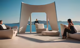 a couple of people sitting on some white couches
