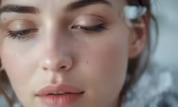 an elegant woman with long eyelashes and false eyelashes